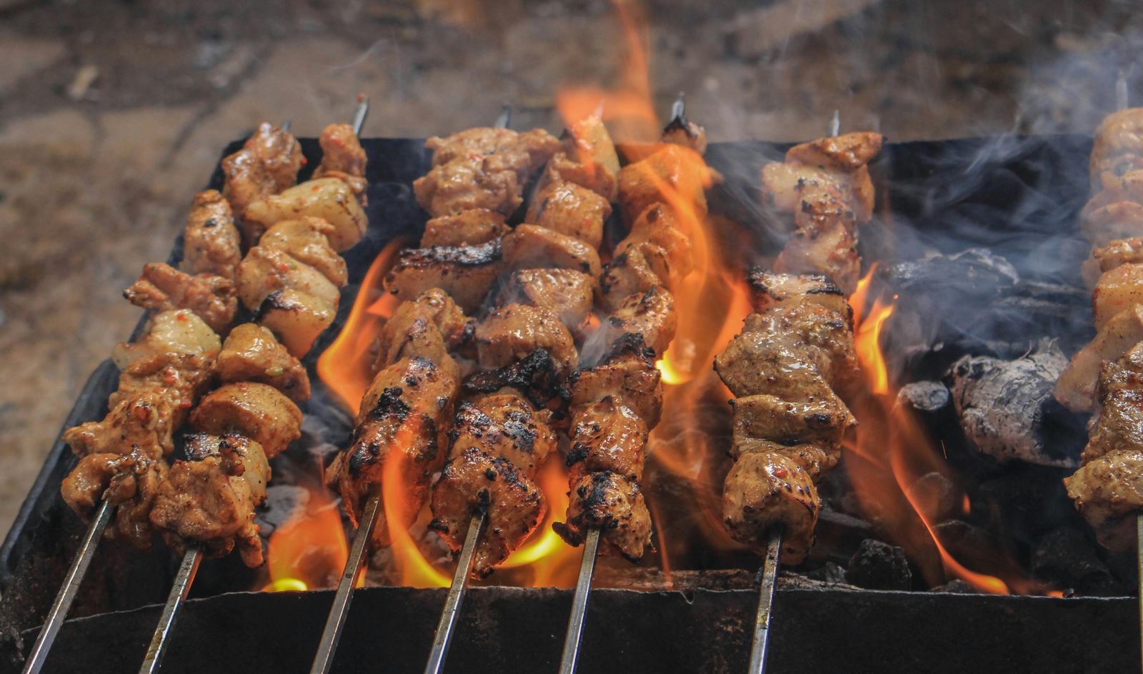 Meat skewers on a hot grill